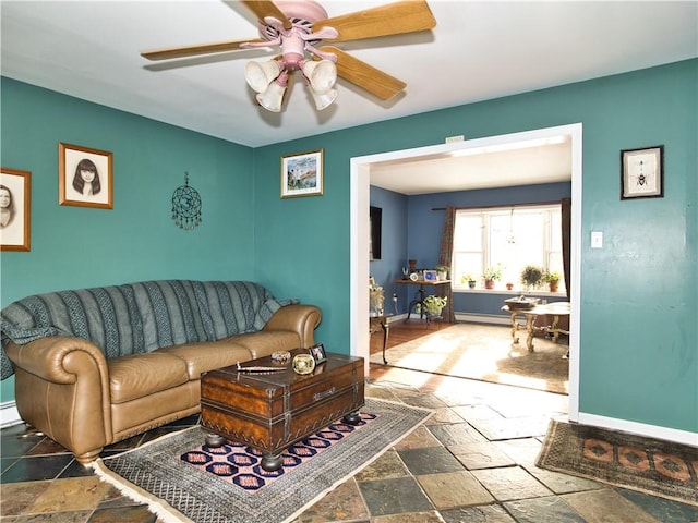 living room featuring ceiling fan