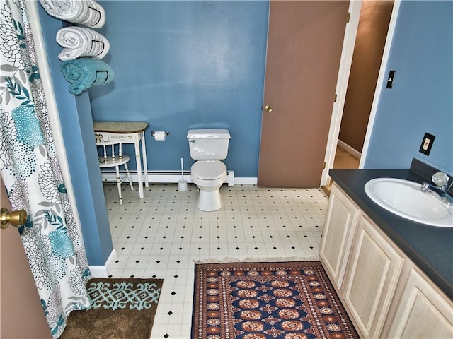 bathroom featuring vanity, a baseboard radiator, and toilet