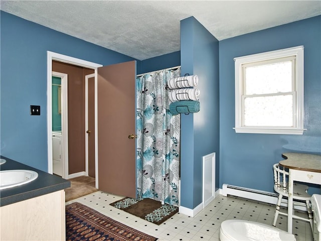 bathroom with vanity, a shower with curtain, and a textured ceiling