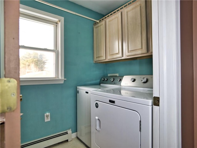 laundry room featuring cabinets, a baseboard radiator, and separate washer and dryer