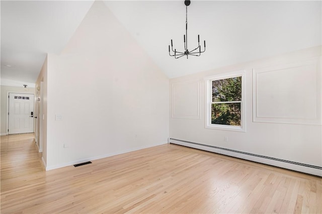 unfurnished dining area with baseboard heating, lofted ceiling, a chandelier, and light wood-type flooring