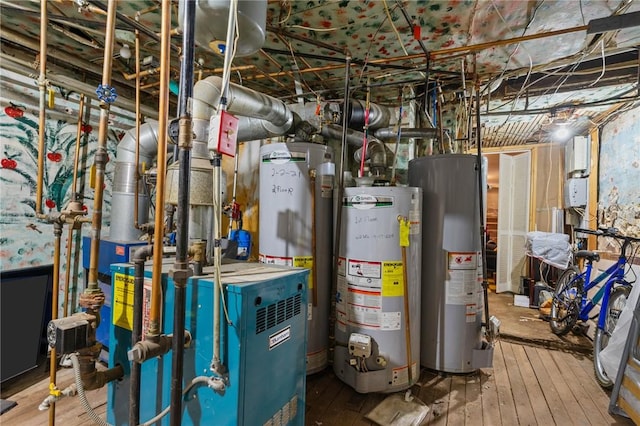 utility room featuring water heater and gas water heater