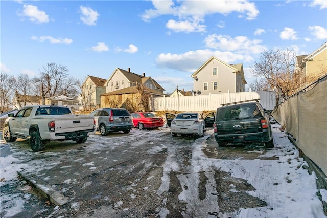 view of snow covered parking area