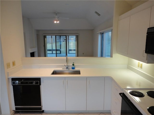 kitchen featuring lofted ceiling, sink, black appliances, and white cabinets