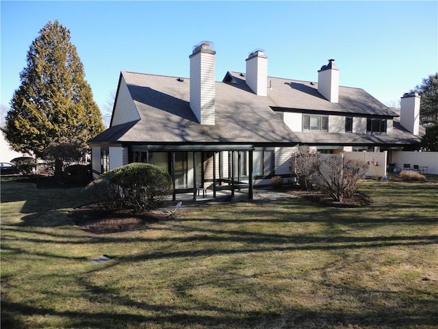 back of house with a yard and a patio area