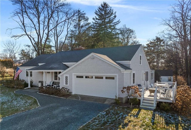 view of front of property with a garage and a wooden deck