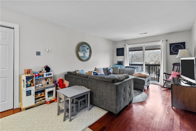 living room with dark hardwood / wood-style flooring