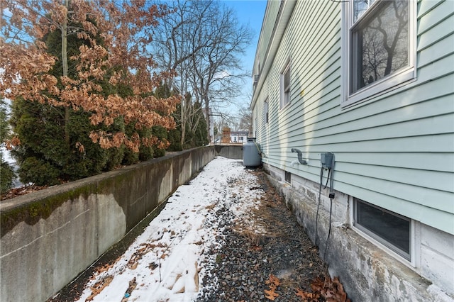 view of yard layered in snow