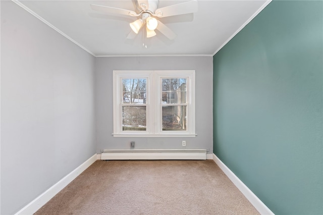 carpeted spare room with crown molding, a baseboard heating unit, and ceiling fan