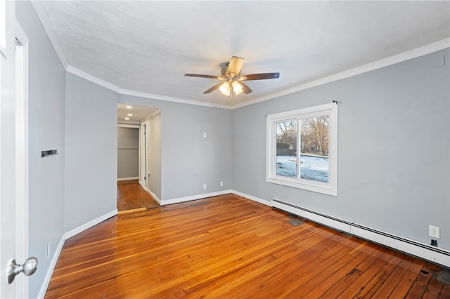 empty room with a baseboard radiator, ornamental molding, wood-type flooring, and ceiling fan