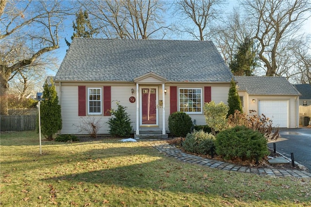 view of front facade featuring a garage and a front lawn