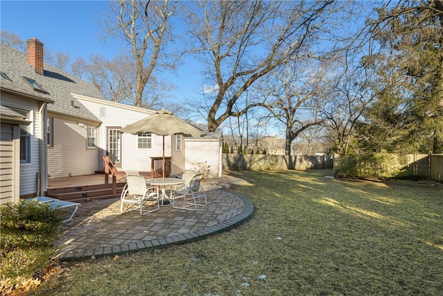 view of yard featuring a patio and a deck