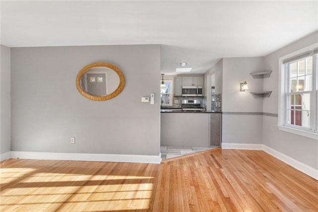 unfurnished room featuring light hardwood / wood-style floors