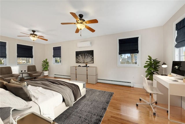 bedroom featuring ceiling fan, light wood-type flooring, a wall unit AC, and a baseboard heating unit