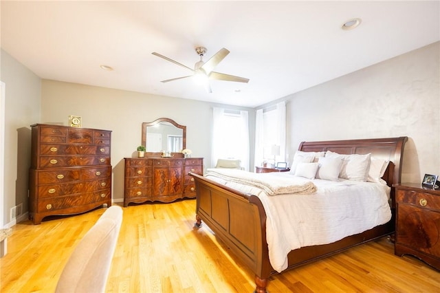 bedroom featuring hardwood / wood-style flooring and ceiling fan