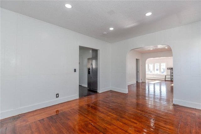 empty room featuring dark hardwood / wood-style floors