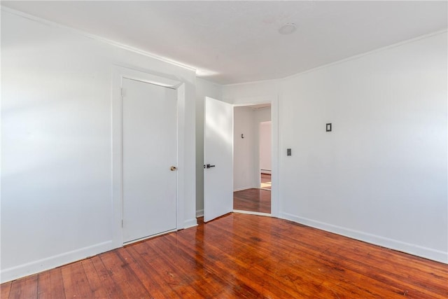 empty room featuring wood-type flooring