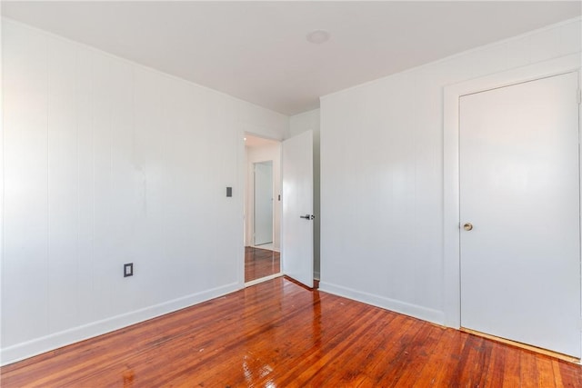 unfurnished bedroom featuring hardwood / wood-style floors