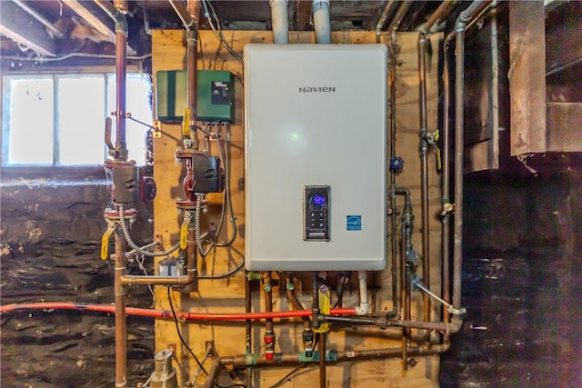 utility room featuring water heater