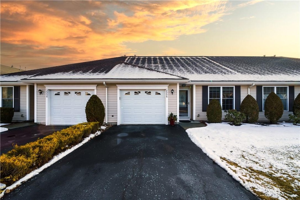 ranch-style house featuring a garage