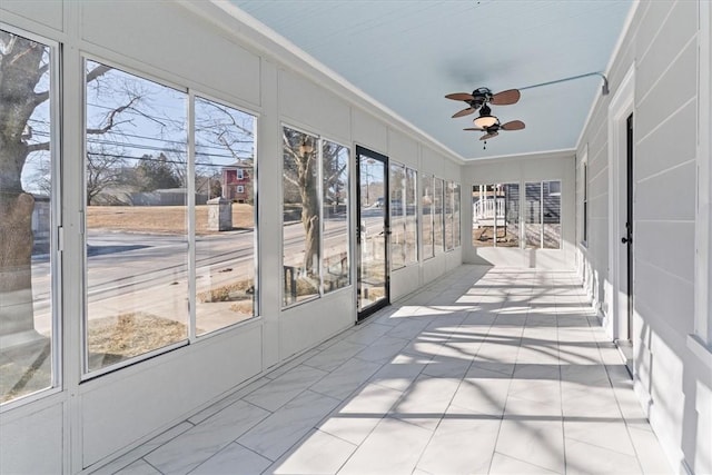 sunroom / solarium with ceiling fan