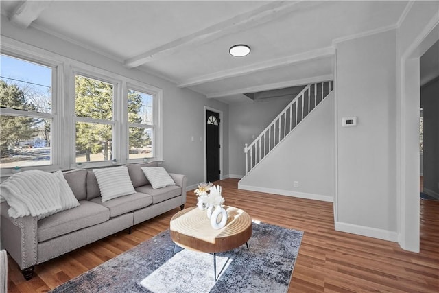 living room with beam ceiling and hardwood / wood-style floors