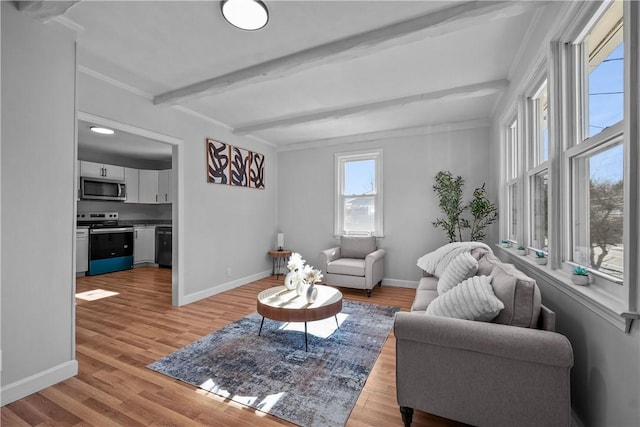 living room with beam ceiling and light wood-type flooring