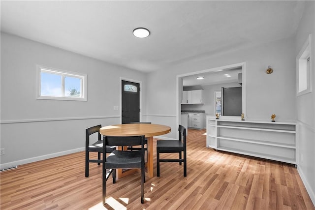 dining room featuring light hardwood / wood-style flooring