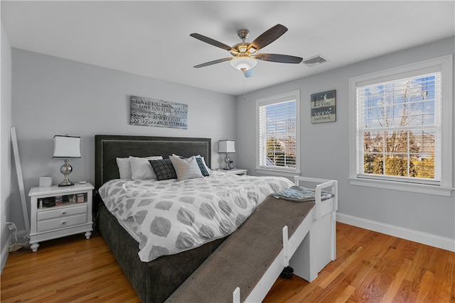 bedroom featuring hardwood / wood-style flooring and ceiling fan