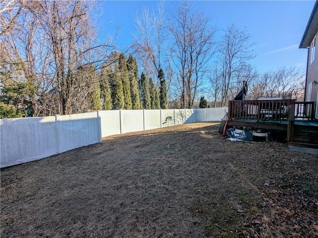 view of yard featuring a wooden deck