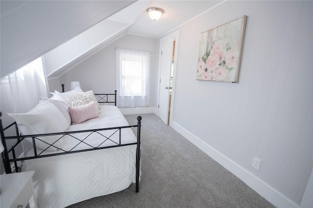 carpeted bedroom featuring lofted ceiling