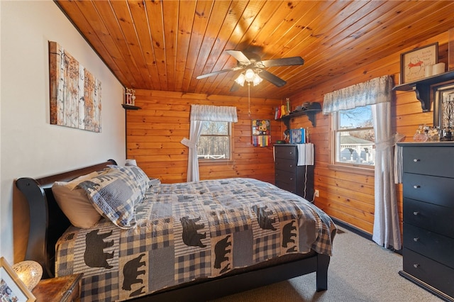 bedroom featuring carpet floors, wood ceiling, and wood walls