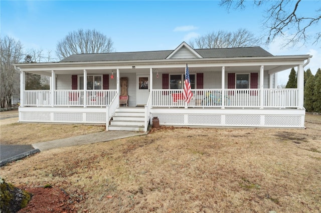 view of front of house with a porch and a front lawn