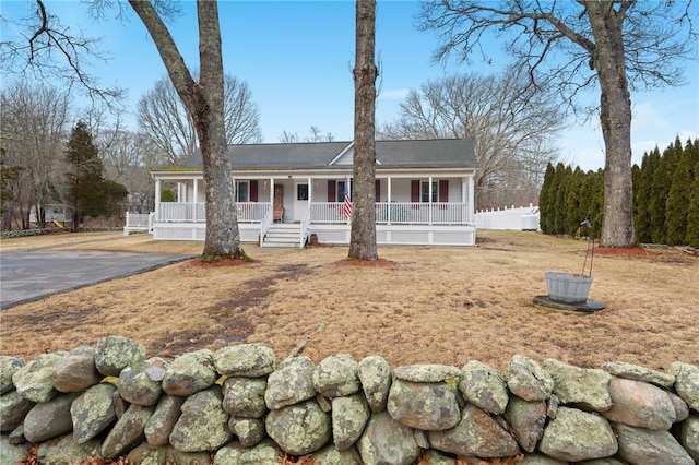 view of front of house featuring a front yard and a porch