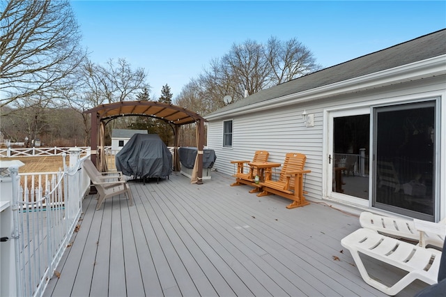 wooden terrace featuring a gazebo