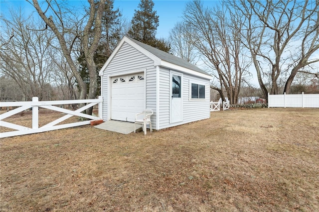 garage featuring a lawn