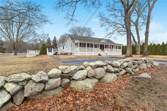 back of house with a porch