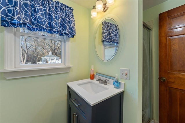 bathroom featuring vanity and an enclosed shower