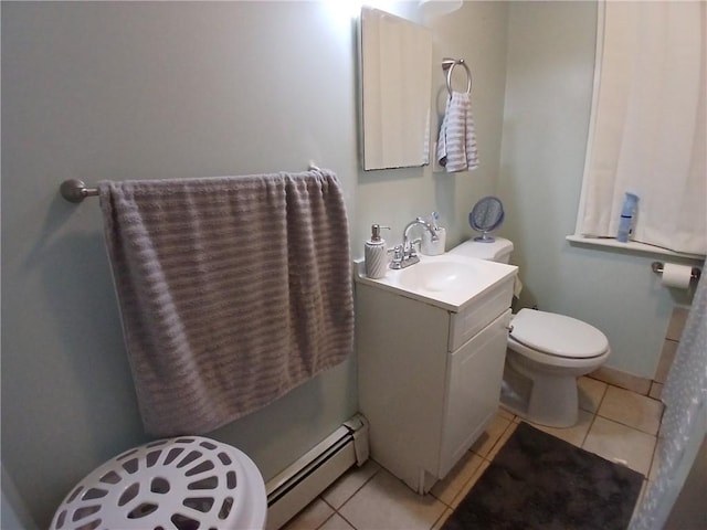 bathroom featuring tile patterned floors, toilet, vanity, and a baseboard heating unit