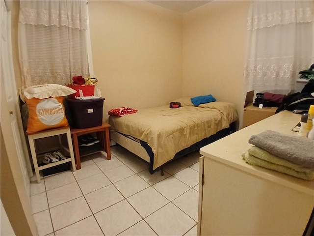 bedroom with tile patterned floors