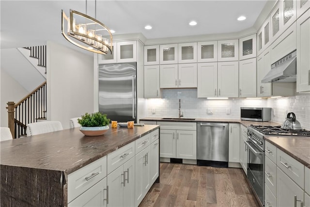 3 White Hawk Rdg, Richmond, RI 02898 - kitchen featuring sink, premium appliances, dark hardwood / wood-style floors, pendant lighting, and white cabinets