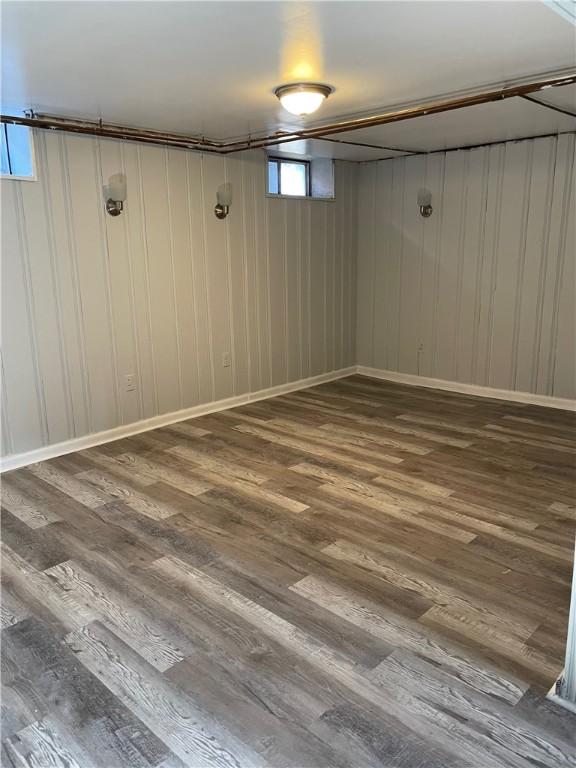 basement with hardwood / wood-style floors