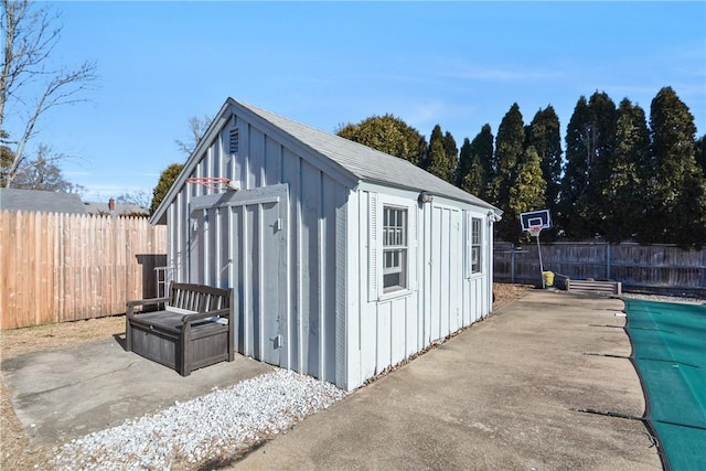 view of outbuilding with a covered pool