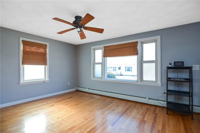 spare room featuring ceiling fan and light wood-type flooring