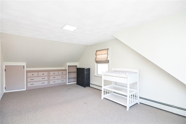 bonus room featuring vaulted ceiling, a baseboard heating unit, and light carpet