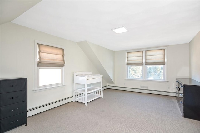 bonus room featuring a baseboard radiator, lofted ceiling, and light colored carpet