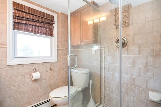 bathroom featuring a baseboard radiator, tiled shower, tile walls, and toilet