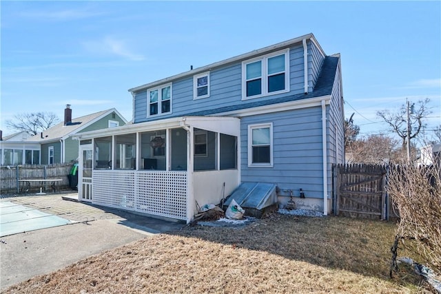 exterior space featuring a sunroom and a patio area