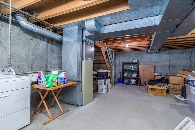 basement with washer / dryer and heating unit