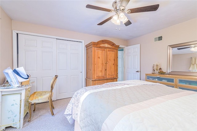 carpeted bedroom featuring a closet and ceiling fan